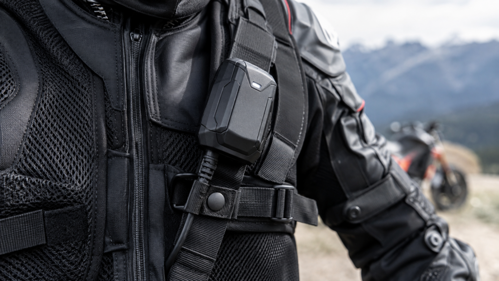 Close-up of an electronic motorcycle airbag vest sensor module integrated into protective riding gear